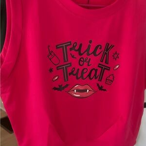 Cute and sexy trick or treat crop top.  Large arm holes with fitted waist.